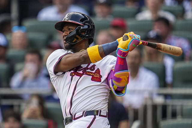 May 25, 2025; Cumberland, Georgia, USA; Atlanta Braves right fielder Ronald Acuna Jr (13) hits a double against the San Diego Padres during the fifth inning at Truist Park. Mandatory Credit: Dale Zanine-Imagn Images/File Photo