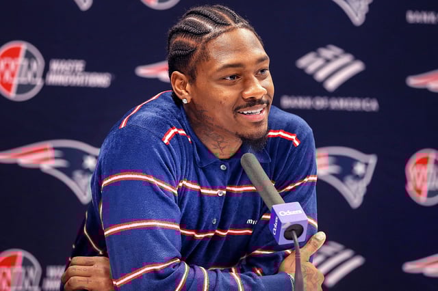 New England Patriots WR Stefon Diggs smiles during his introductory press conference in Foxborough, Mass., on March 28, 2025.