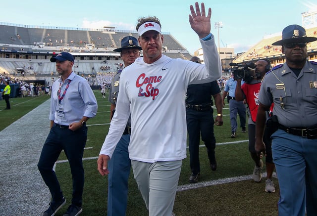 Mississippi coach Lane Kiffin waves to fans after his team's defeat of Georgia Tech at Bobby Dodd Stadium in 2022.