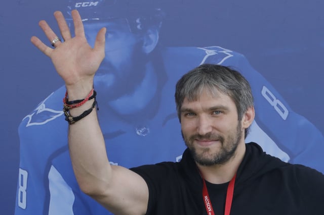 Washington Capitals captain Alex Ovechkin waves as he brings the Stanley Cup trophy to the FIFA Fan Fest in Moscow, a host city for the 2018 FIFA World Cup, Russia July 7, 2018. REUTERS/Tatyana Makeyeva/ File Photo