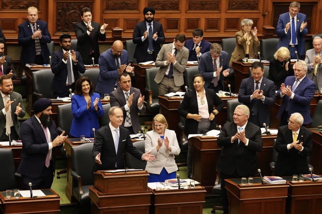 Ontario Finance Minister Peter Bethlenfalvy gestures to the house as Premier Doug Ford looks on, while delivering the budget, at the Queen's Park Legislature in Toronto, on Thursday, May 15, 2025.