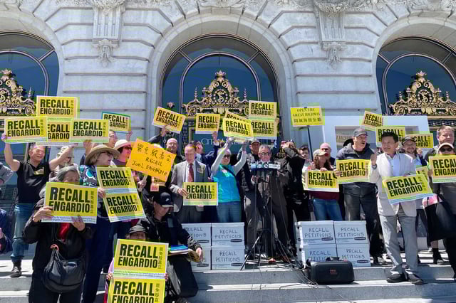 Supporters and organizers of the recall campaign against District 4 Supervisor Joel Engardio rally on San Francisco City Hall steps. The recall qualified for the ballot on Thursday.