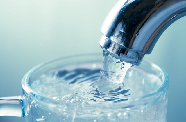 A stock photo of a faucet.