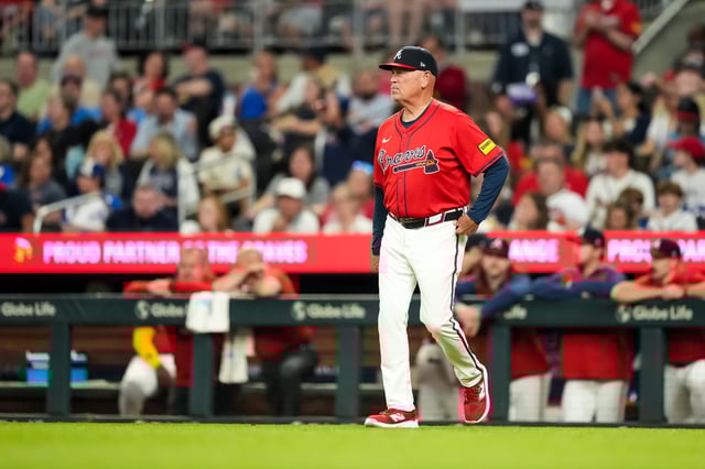 ATLANTA, GA - APRIL 18: Manager Brian Snitker #43 of the Atlanta Braves looks on against the Minnesota Twins on April 18, 2025 at Truist Park in Atlanta, Georgia.