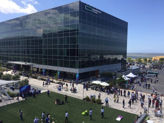 Hewlett Packard Enterprise employees gather next to the new HPE
headquarters at 6280 America Center in San Jose. Hewlett Packard Enterprise
on Tuesday unveiled a gleaming new office building in north San Jose,
bringing a world-class tech company’s headquarters into the Bay Area’s
largest city.
George Avalos / Bay Area News Group
4-30-2019, San Jose CA