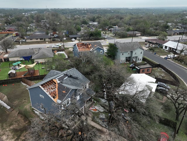 Two houses on Springdale Road and Overhill Drive in Austin, shown Thursday, May 29, 2025, had part of their roofs blown away in a storm on Wednesday.