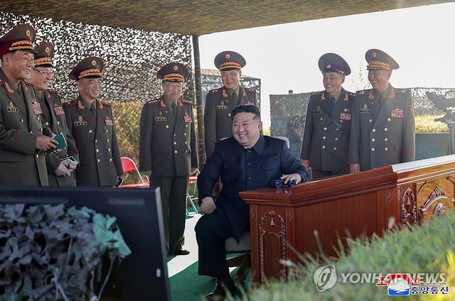 This file photo, published by the Korean Central News Agency, shows North Korean leader Kim Jong-un overseeing a live firing drill at a military artillery school in October 2024. (For Use Only in the Republic of Korea. No Redistribution) (Yonhap)