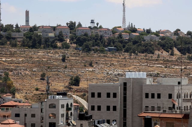 Houses are pictured in the Israeli settlement of Psagot in the occupied West Bank, located on Tawil hill adjacent to the Palestinian cities of Ramallah and al-Bireh, on May 29, 2025.