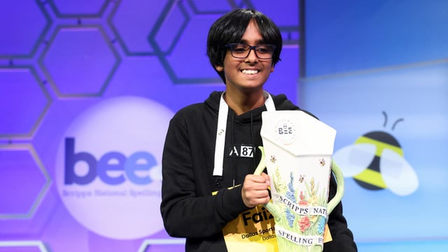 Faizan Zaki, 13, of Dallas, Texas, holds the prize after winning the annual Scripps National Spelling Bee in National Harbor, Maryland, U.S., May 29, 2025. 