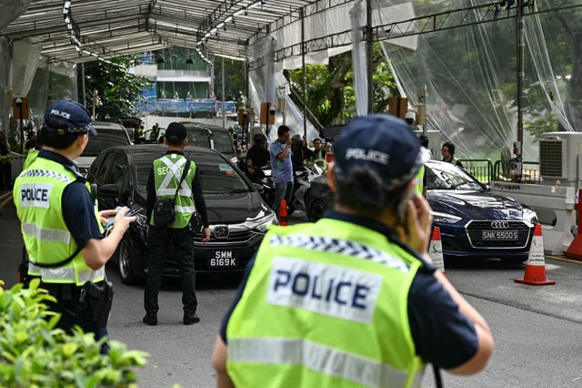Police keep watch on vehicles entering the venue of the Shangri-La Dialogue Summit in Singapore on May 30, 2025. (Photo by MOHD RASFAN / AFP) (Photo by MOHD RASFAN/AFP via Getty Images)