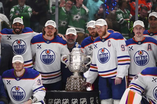 Edmonton Oilers pose for photos after winning Game 5 of the Western Conference finals against the Dallas Stars in the NHL hockey Stanley Cup playoffs, Thursday, May 29, 2025, in Dallas. 