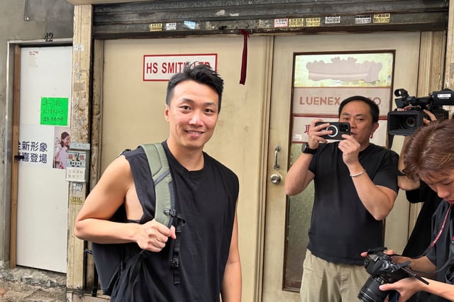 Hong Kong's pro-democracy activist Jimmy Sham poses for photos after being released from prison in Hong Kong, Friday, May 30, 2025. (AP Photo/Kanis Leung)