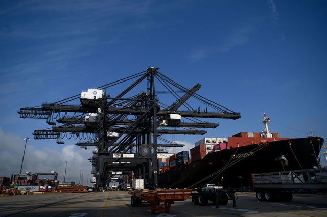 Ship-to-shore (STS) cranes load a container ship at the Bayport Container Terminal at the port of Houston in Seabrook, Texas, US, on Thursday, May 22.