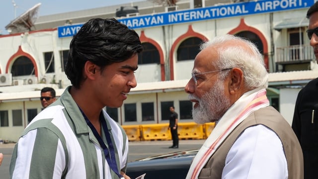 Prime Minister Narendra Modi with Vaibhav Suryavanshi at the Patna airport.