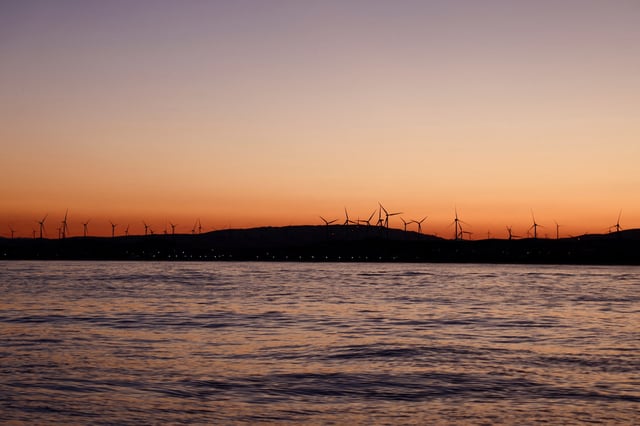 Wind turbines spin in front of the Atlantic Ocean near Zahara de los Atunes, Spain May 27, 2025. REUTERS/Nacho Doce/File Photo