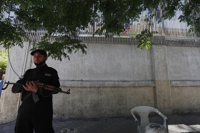 A member of the security forces stands guard outside the U.S. ambassador&#39;s residence as U.S. Ambassador to Turkey and Special Envoy to Syria Tom Barrack arrives to inaugurate the long-shuttered compound in Damascus, Syria, Thursday, May 29, 2025.