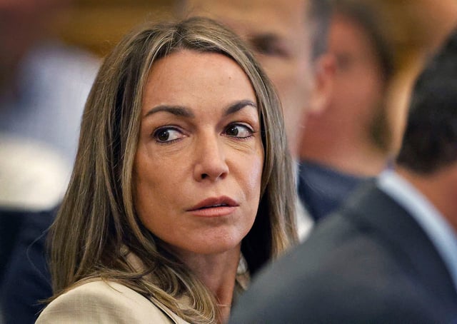 Karen Read listens to the cross examination by Robert Alessi of expert accident witness Dr. Judson Welcher while seated at the defense table with her attorneys Alan Jackson and David Yannetti during her retrial at Norfolk Superior Court, Wednesday May 28, 2025, in Dedham, Mass.
