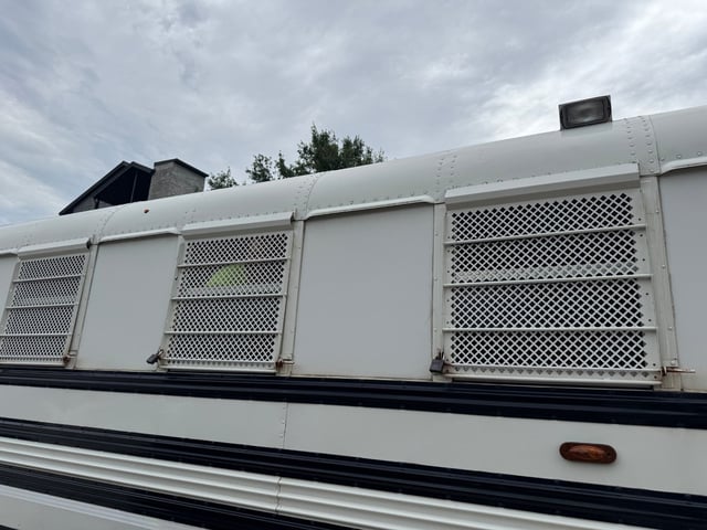 At least 30 individuals were detained and held in a white bus with grated windows as part of an immigration operation led by U.S. Immigration and Customs Enforcement on Thursday, May 29, 2025. (Ana Ceballos/Miami Herald/TNS)