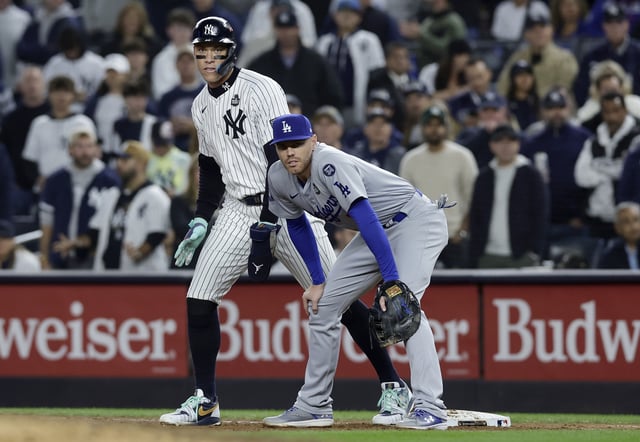 NEW YORK, NEW YORK - OCTOBER 29: (NEW YORK DAILIES OUT) Aaron Judge #99 of the New York Yankees in action against Freddie Freeman #5 of the Los Angeles Dodgers during Game Four of the 2024 World Series at Yankee Stadium on October 29, 2024 in New York City. The Yankees defeated the Dodgers 11-4.