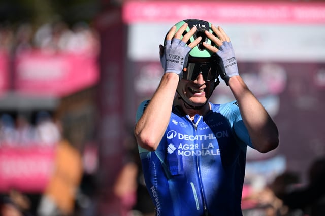 Cycling - Giro d'Italia - Stage 19 - Biella to Champoluc - Italy - May 30, 2025 Decathlon AG2R La Mondiale Team's Nicolas Prodhomme celebrates as he crosses the finish line to win stage 19 REUTERS/Jennifer Lorenzini