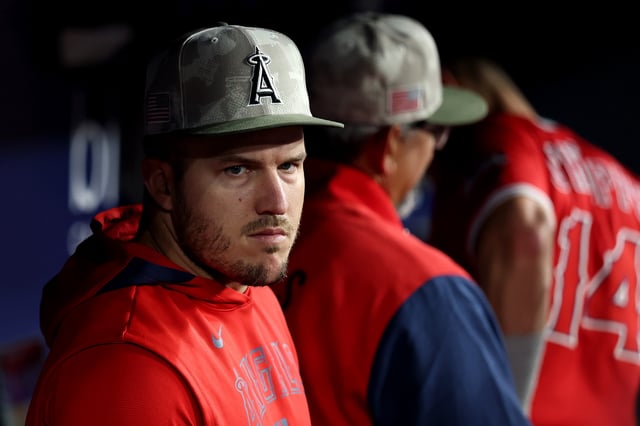 LOS ANGELES, CALIFORNIA - MAY 17: Mike Trout of the Los Angeles Angels looks on in the dugout against the Los Angeles Dodgers during the seventh inning at Dodger Stadium on May 17, 2025 in Los Angeles, California.