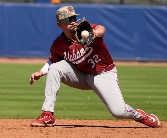 May 21, 2025; Hoover, AL, USA; Alabama third baseman Jason Torres (32) snags a line drive during the game with Tennessee in the second round of the SEC Baseball Tournament at the Hoover Met.