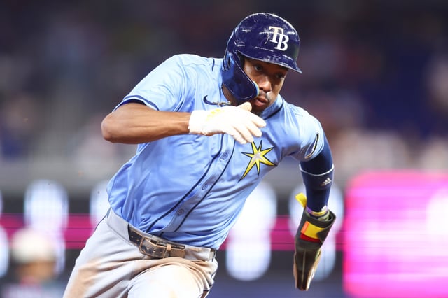 MIAMI, FLORIDA - MAY 17: Chandler Simpson #14 of the Tampa Bay Rays runs to third base against the Miami Marlins in the ninth inning of the game at loanDepot park on May 17, 2025 in Miami, Florida.