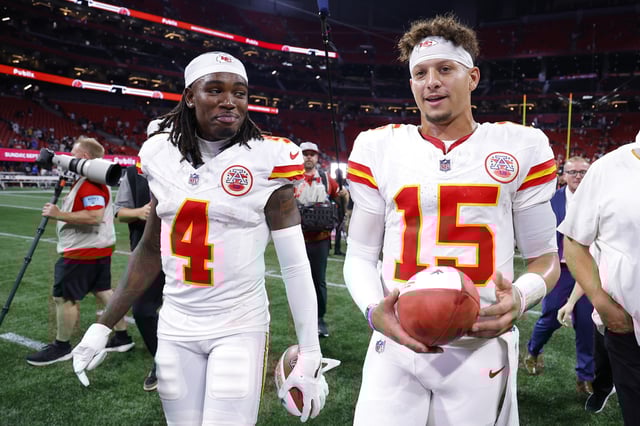 Rashee Rice #4 and Patrick Mahomes #15 of the Kansas City Chiefs walk off the field after a win over the Atlanta Falcons at Mercedes-Benz Stadium on September 22, 2024 in Atlanta, Georgia.