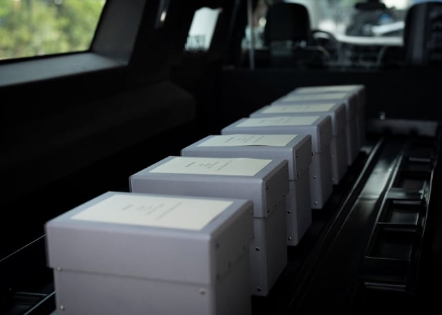 The skulls of 19 Black people who were returned to New Orleans after more than 150 years in Germany are loaded into a hearse for a memorial service. The remains were wrongfully taken out of the country in the late 1800s for racially-based scientific research.