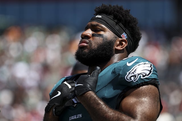 Bryce Huff #0 of the Philadelphia Eagles stands on the sidelines during the national anthem prior to an NFL football game against the Tampa Bay Buccaneers at Raymond James Stadium on September 29, 2024 in Tampa, Florida.