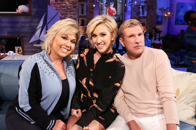Julie Chrisley, left, and Todd Chrisley with their daughter Savannah Chrisley, center.