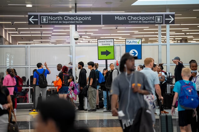 Travelers stand in a long line for security screening at Hartsfield-Jackson Atlanta International Airport on June 28, 2024 in Atlanta, Georgia. The Transportation Security Administration (TSA) says they are anticipating a &#34;sustained period of high passenger volumes&#34; that will break previous travel records.