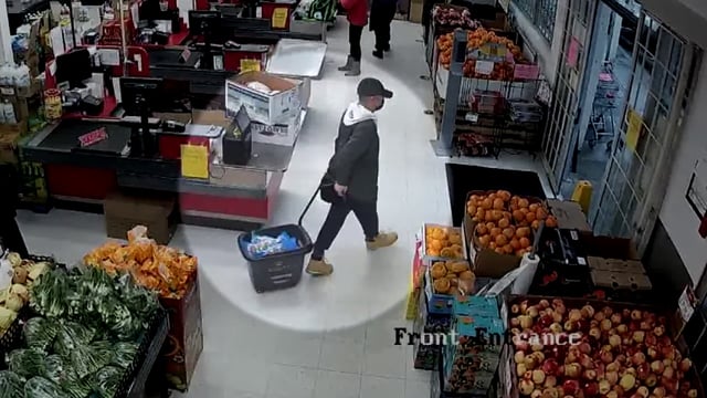 A shoplifting suspect is caught on camera at the New Empire Supermarket in Richmond in 2024.