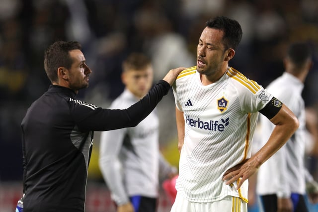 Galaxy defender Maya Yoshida, right, is consoled by strength and conditioning coach Adam Waterson at the end of their 1-0 loss to the San Jose Earthquakes on Wednesday, May 28, 2025, at Dignity Health Sports Park. (Photo by Raul Romero Jr., Contributing Photographer)
