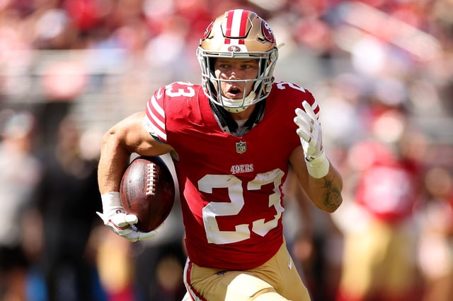 Christian McCaffrey #23 of the San Francisco 49ers runs with the ball against the Arizona Cardinals at Levi&#39;s Stadium on October 01, 2023 in Santa Clara, California.