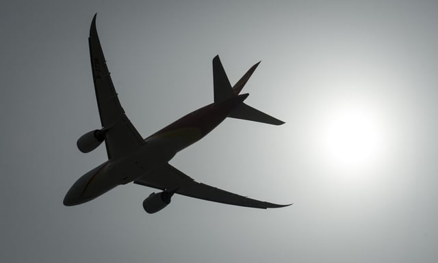 A plane is silhouetted as it takes off from Vancouver International Airport in Richmond, B.C., Monday, May 13, 2019. The RCMP says air restrictions will be in place in two main areas during the upcoming G7 Leaders' Summit in Alberta this June. THE CANADIAN PRESS/Jonathan Hayward