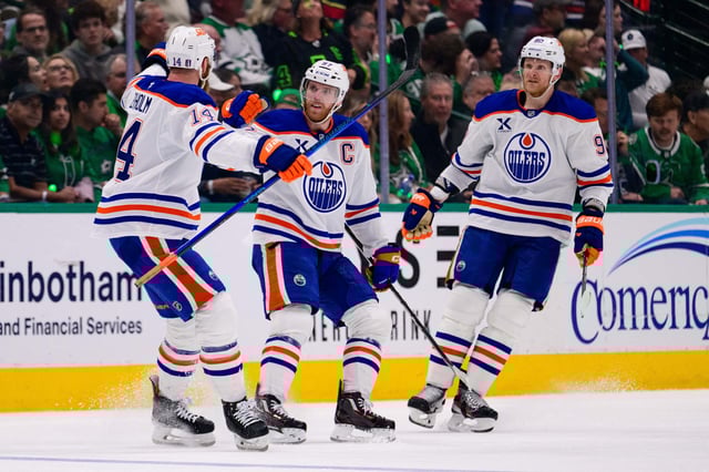 May 29, 2025; Dallas, Texas, USA; Edmonton Oilers center Connor McDavid (97) and defenseman Mattias Ekholm (14) and right wing Corey Perry (90) celebrates after McDavid scores a goal against the Dallas Stars during the third period in game five of the Western Conference Final of the 2025 Stanley Cup Playoffs at American Airlines Center. Mandatory Credit: Jerome Miron-Imagn Images