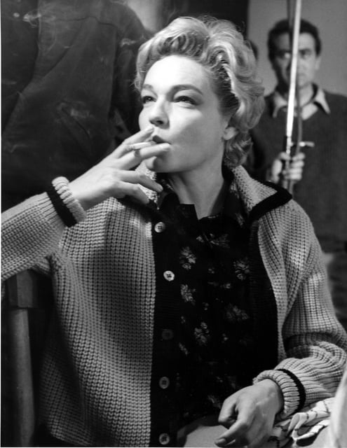 FILE - French actress Simone Signoret smokes a cigarette on a film set in Rome, Italy, May 4, 1960. (AP Photo/Jim Pringle, File)