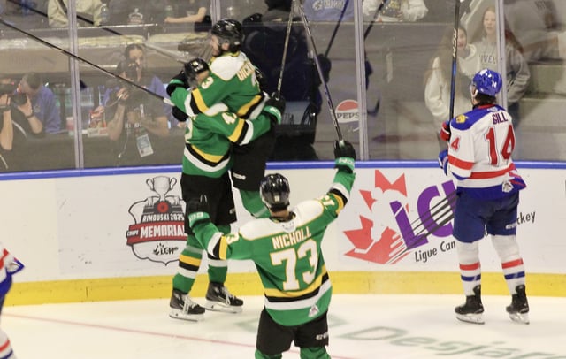 Rimouski, QC - London Knights defenceman Sam Dickinson jumps into the arms of London forward Blake Montgomery after Montgomery's go-ahead goal in the third period of the Knights 5-2 win over Moncton in the semi-final of the 2025 Memorial Cup tournament.