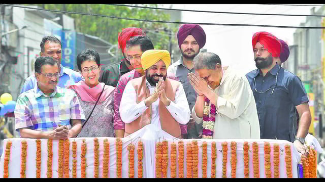 AAP national convener Arvind Kejriwal, former Delhi CM Atishi Marlena, Punjab CM Bhagwant Mann and Punjab AAP president Aman Arora accompanying party candidate Sanjeev Arora for filing of nomination papers in Ludhiana on Friday. They took out a roadshow from Aarti Chowk and ended at Bhai Bala Chowk in the city. (Gurpreet Singh/HT)