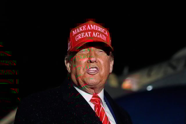 President Donald Trump speaks to reporters in the rain after arriving on Air Force One at Joint Base Andrews, Md., Friday, May 30, 2025. (AP Photo/Julia Demaree Nikhinson)