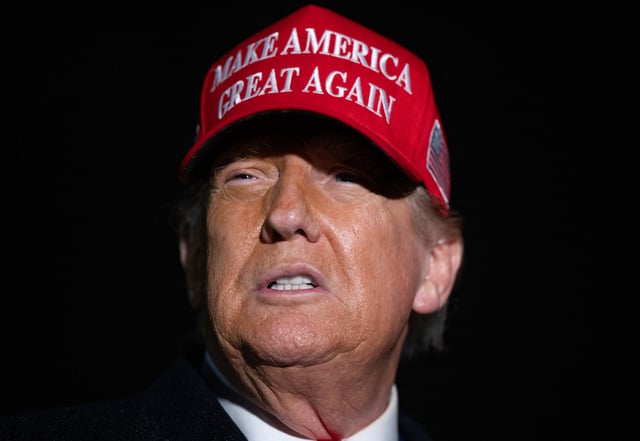 President Donald Trump speaks to the press in the rain after landing on Air Force One at Joint Base Andrews in Maryland, May 30, 2025, after traveling to Pennsylvania to visit a US Steel plant.