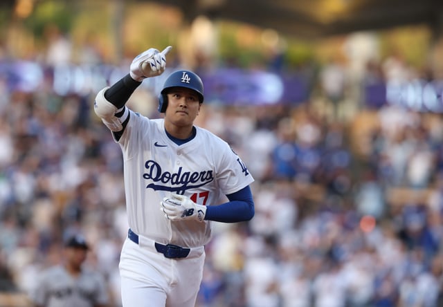 Dodgers' Shohei Ohtani rounds the bases after hitting a home run during the first inning against the Yankees.