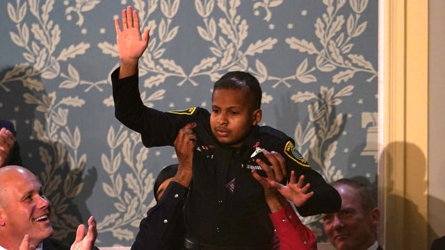 Cancer survivor Devarjaye DJ Daniel, 13, waves as he is lifted up while being recognized by US President Donald Trump during his address to a joint session of Congress at the US Capitol in Washington, DC, on March 4, 2025. (Photo by ALLISON ROBBERT / AFP)