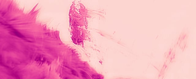 still from clip of corona particles falling