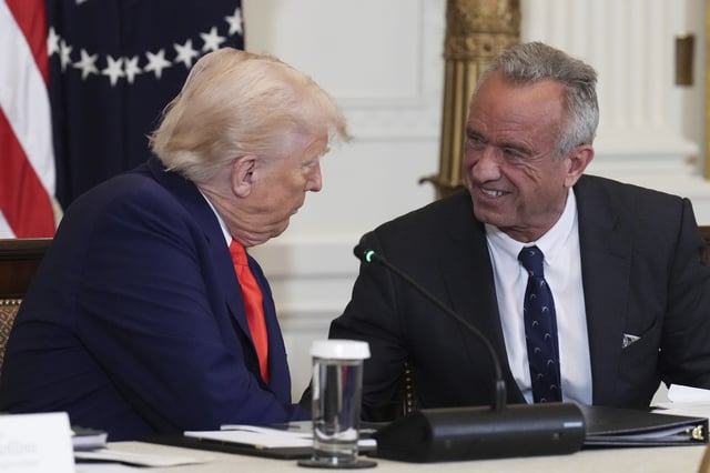 President Donald Trump, left, and Health and Human Services Secretary Robert F. Kennedy Jr. attend a Make America Healthy Again (MAHA) Commission Event in the East Room of the White House, Thursday, May 22, 2025, in Washington. (AP Photo/Jacquelyn Martin)