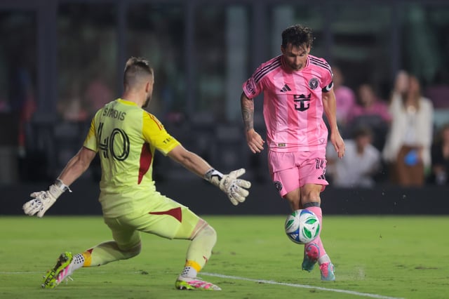 May 28, 2025; Fort Lauderdale, Florida, USA; Inter Miami CF forward Lionel Messi (10) chips the ball over CF Montreal goalkeeper Jonathan Sirois (40) and scores during the second half at Chase Stadium. Mandatory Credit: Sam Navarro-Imagn Images