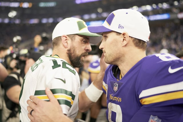 MINNEAPOLIS, MN - NOVEMBER 25: Kirk Cousins #8 of the Minnesota Vikings and Aaron Rodgers #12 of the Green Bay Packers speak after the game at U.S. Bank Stadium on November 25, 2018 in Minneapolis, Minnesota. (