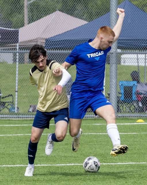  Anthony Franze of North American Trade School battles with Tricar’s Nenad Golic.