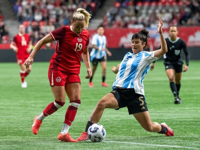 Argentina's Vanina Preininger (5) stops Canada's Adriana Leon (19) during the first half of an international friendly soccer match in Vancouver, on Friday, April 4, 2025.